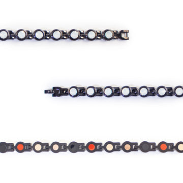 Close-up of white crystals and polished black links.